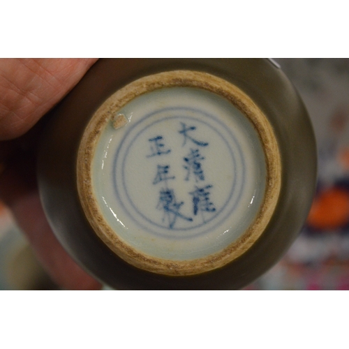 450 - A pair of Chinese tea dust glazed pottery bowls.