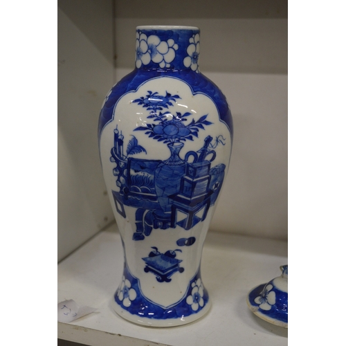 463 - Chinese blue and white baluster shaped vase and cover together with three ginger jars.