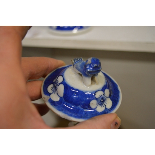 463 - Chinese blue and white baluster shaped vase and cover together with three ginger jars.