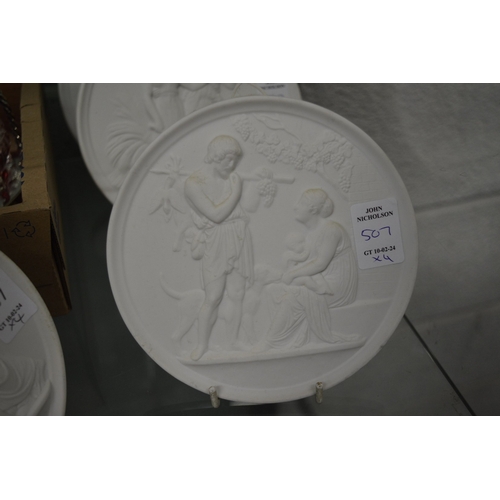 507 - A set of four Copenhagen circular white biscuit porcelain plaques.