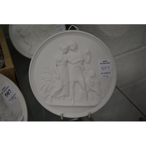 507 - A set of four Copenhagen circular white biscuit porcelain plaques.