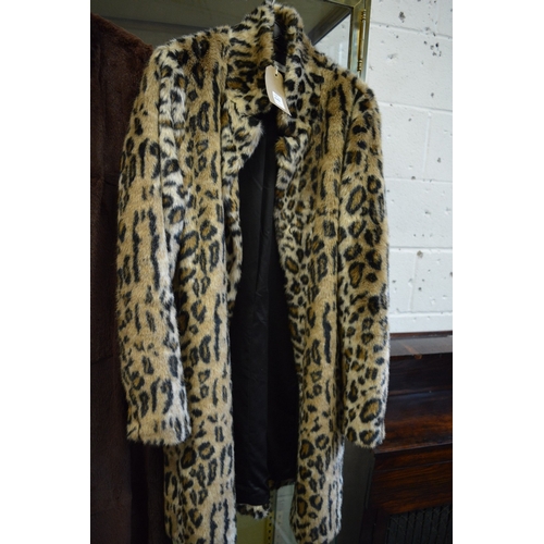 642 - A Denim Hunter faux leopard skin coat.