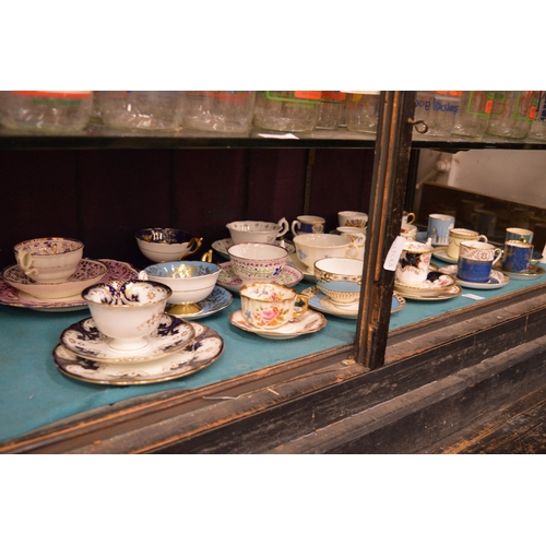 71 - A collection of tea and coffee cups with saucers, some trio's.