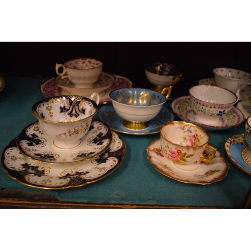 71 - A collection of tea and coffee cups with saucers, some trio's.