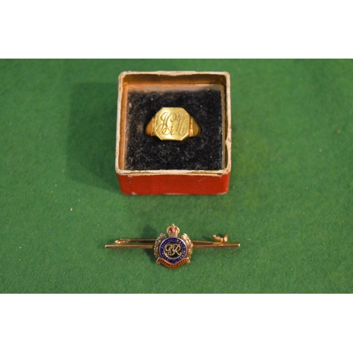 759 - A gold signet ring and a 9 carat gold and enamel Royal Engineers bar brooch.