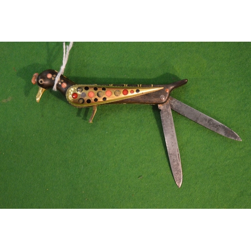 769 - An unusual Islamic twin bladed pen knife modelled as a bird.