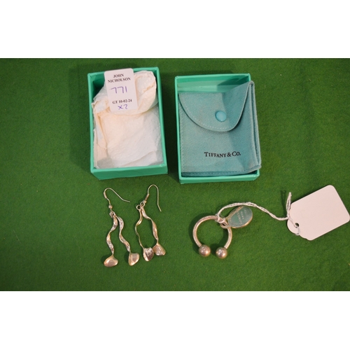 771 - Tiffany & Co, a silver key ring with original pouch and box together with a pair of silver earrings,... 