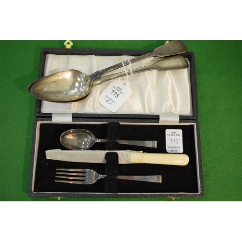 775 - Two Georgian silver serving spoons and a cased silver Christening set.