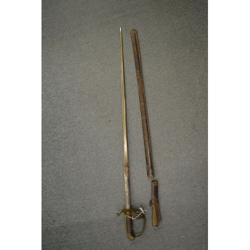 832 - A sword and scabbard with carved wood grip, brass knuckle guard and leather covered scabbard (faults... 