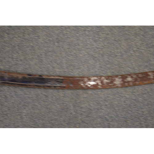 833 - A Scimitar with horn handle, etched and blued steel blade with leather covered scabbard and brass mo... 