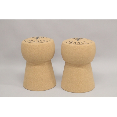 1008 - A PAIR OF CHAMPAGNE CORK STOOLS. 1ft 7ins high.