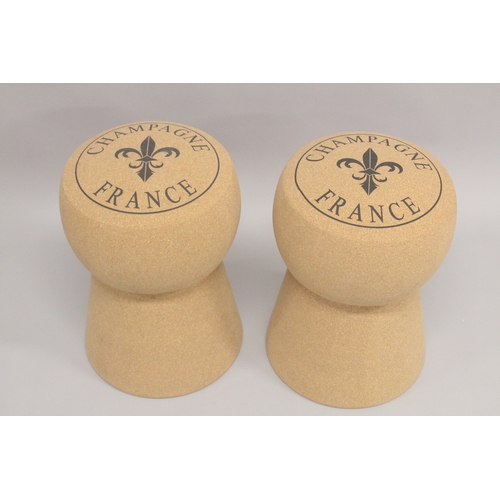 1008 - A PAIR OF CHAMPAGNE CORK STOOLS. 1ft 7ins high.