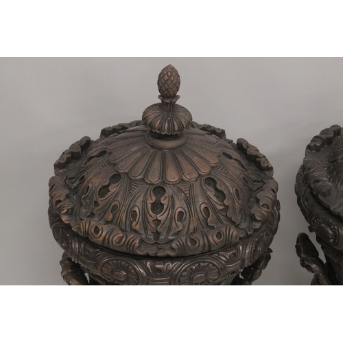 1005 - A GOOD LARGE PAIR OF URNS AND COVERS, POSSIBLY IRISH, carved with cupids and scrolls, with pineapple... 