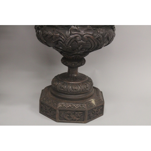 1005 - A GOOD LARGE PAIR OF URNS AND COVERS, POSSIBLY IRISH, carved with cupids and scrolls, with pineapple... 