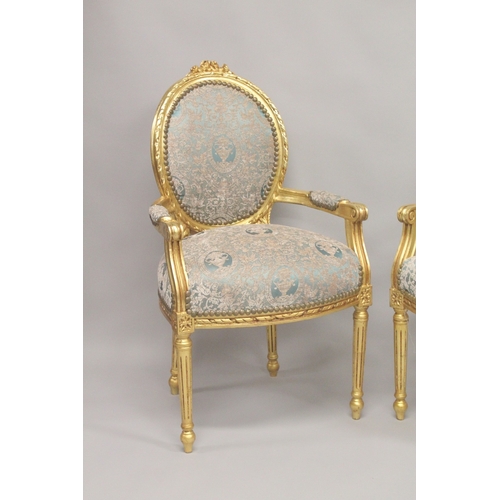 1010 - A PAIR OR LOUIS XVITH DESIGN GILTWOOD ARMCHAIRS with oval backs.