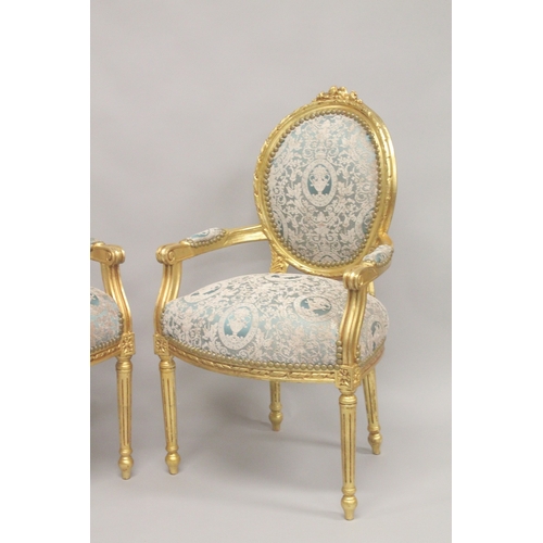 1010 - A PAIR OR LOUIS XVITH DESIGN GILTWOOD ARMCHAIRS with oval backs.