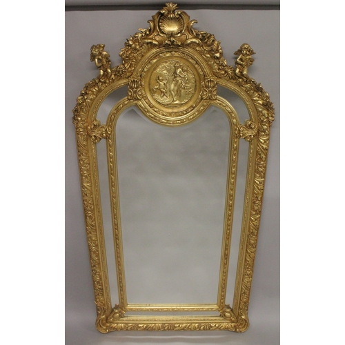 1012 - A VERY GOOD LOUIS XVITH DESIGN GILTWOOD MIRROR with cupids, scrolls etc. 7ft high x 2ft 6ins wide.... 