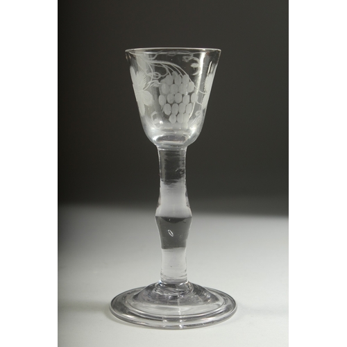 1035 - A GEORGIAN WINE GLASS with knop stem, the bowl engraved with fruiting vines. 5.5ins high.