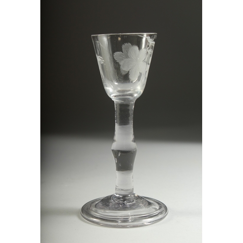 1035 - A GEORGIAN WINE GLASS with knop stem, the bowl engraved with fruiting vines. 5.5ins high.