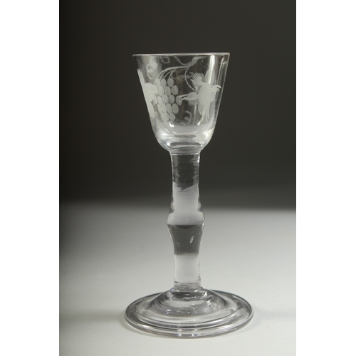 1035 - A GEORGIAN WINE GLASS with knop stem, the bowl engraved with fruiting vines. 5.5ins high.