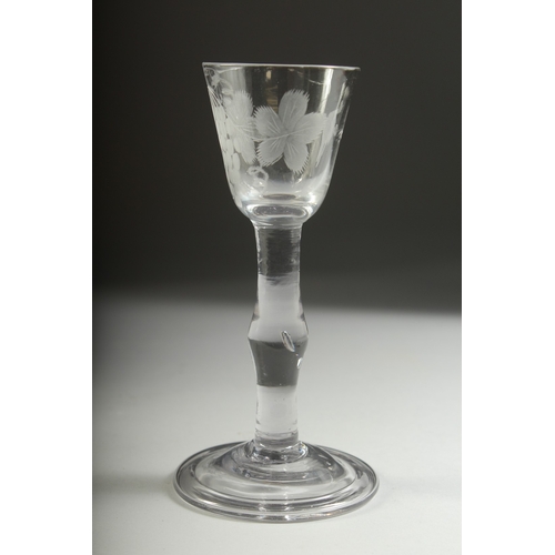 1035 - A GEORGIAN WINE GLASS with knop stem, the bowl engraved with fruiting vines. 5.5ins high.