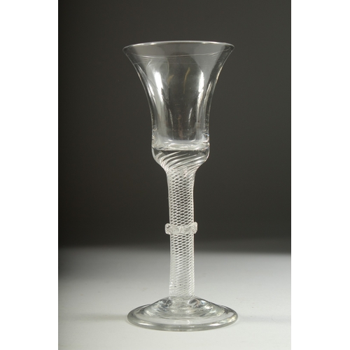 1036 - A GEORGIAN WINE GLASS with inverted bell bowl, knop stem with air twist. 7ins high.