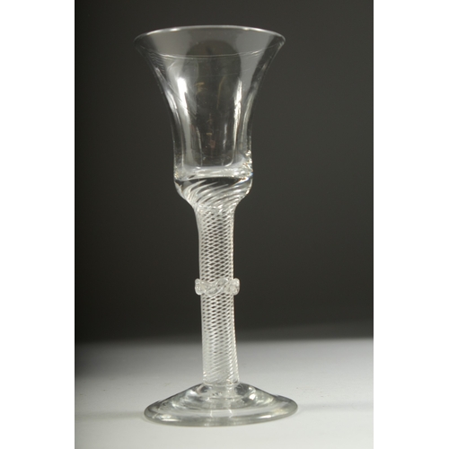 1036 - A GEORGIAN WINE GLASS with inverted bell bowl, knop stem with air twist. 7ins high.