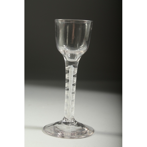 1037 - A GEORGIAN WINE GLASS with white air twist stem. 5.5ins high.