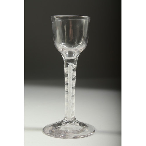 1037 - A GEORGIAN WINE GLASS with white air twist stem. 5.5ins high.