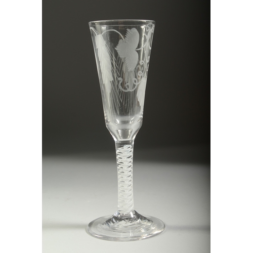 1038 - A GEORGIAN WINE GLASS with white air twist stem, long flute engraved with hops. 7ins high.