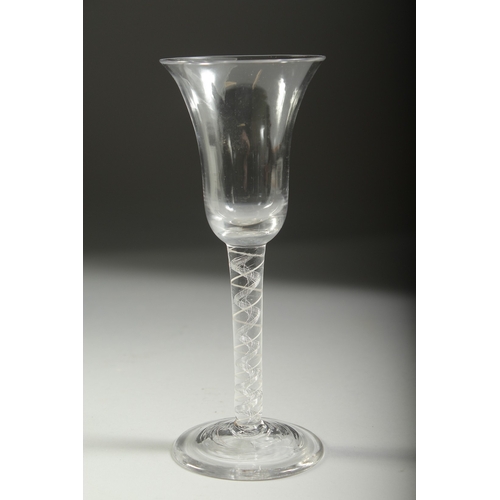 1040 - A GEORGIAN WINE GLASS with inverted bell bowl and white twist stem. 6.75ins high.