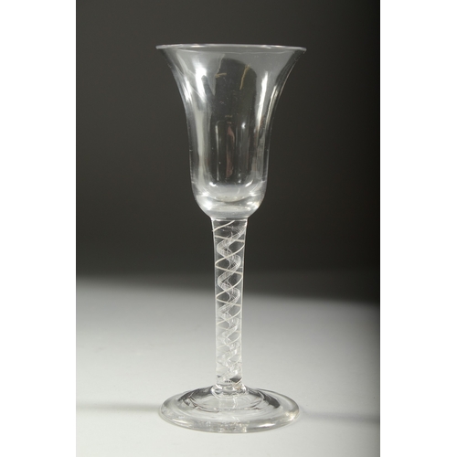 1040 - A GEORGIAN WINE GLASS with inverted bell bowl and white twist stem. 6.75ins high.