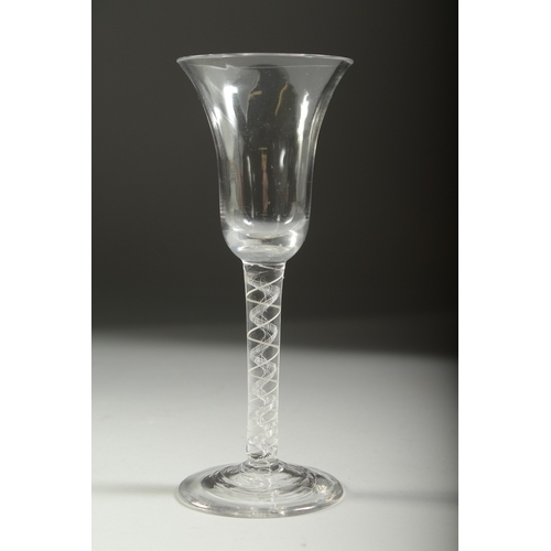 1040 - A GEORGIAN WINE GLASS with inverted bell bowl and white twist stem. 6.75ins high.