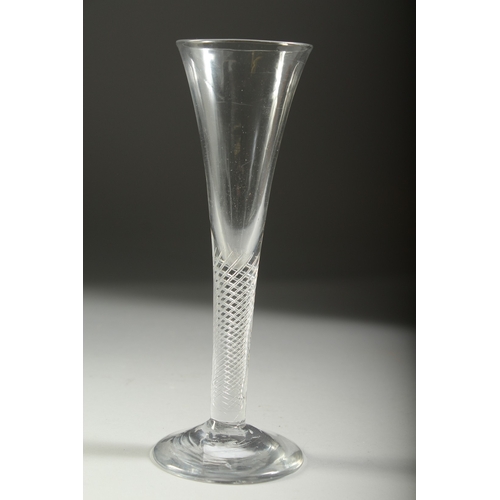 1041 - A GEORGIAN WINE GLASS with long, plain tapering bowl and air twist stem. 7.25ins high.