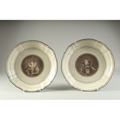 1089 - A PAIR OF 18TH CENTURY CIRCULAR PORTRAIT PLATES of Queens. 10.5ins diameter.