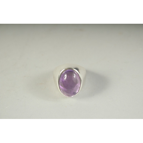 1654 - A SILVER AMETHYST RING.