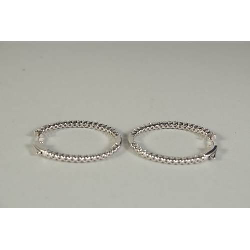 1775 - A PAIR OF WHITE GOLD AND DIAMOND HOOP EARRINGS.