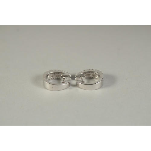 1779 - A PAIR OF 18CT WHITE GOLD BAGUETTE CUT HOOP EARRINGS.