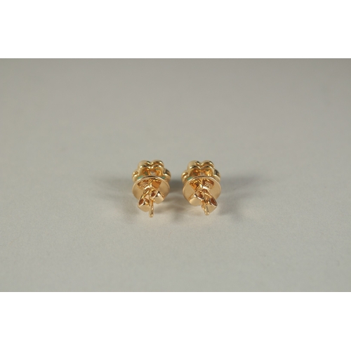 1780 - A PAIR OF 18CT YELLOW GOLD, DIAMOND AND EMERALD FLOWER HEAD EAR STUDS.