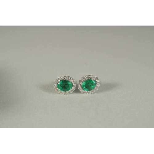 1781 - A PAIR OF 18CT WHITE GOLD. DIAMOND AND EMERALD EAR STUDS.