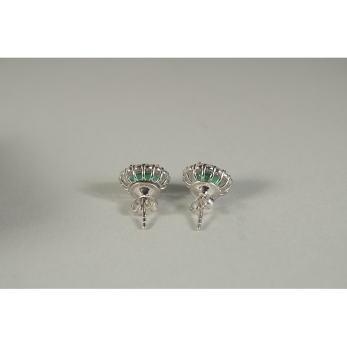 1781 - A PAIR OF 18CT WHITE GOLD. DIAMOND AND EMERALD EAR STUDS.