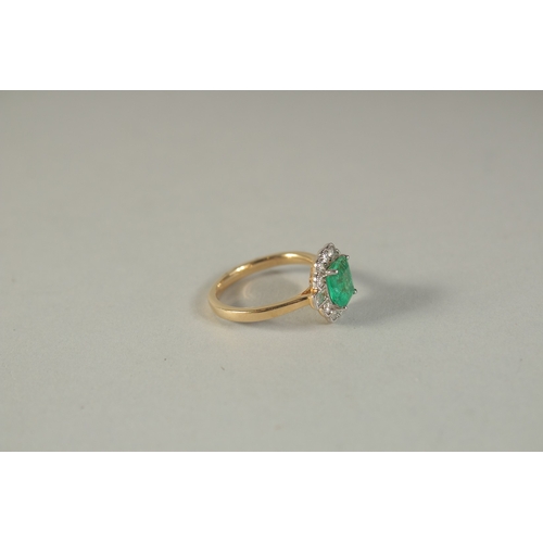 1784 - AN 18CT YELLOW GOLD, DIAMOND, EMERALD OCTAGONAL SHAPE CLUSTER RING.