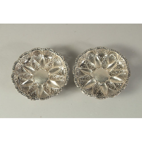 1864 - A PAIR OF REPOUSSE SILVER BON BON DISHES. Birmingham.  4.25ins diameter.