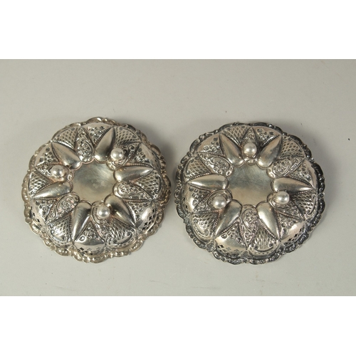 1864 - A PAIR OF REPOUSSE SILVER BON BON DISHES. Birmingham.  4.25ins diameter.