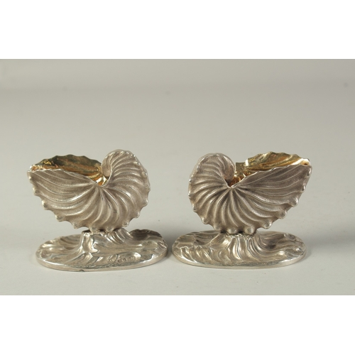 1865 - A GOOD PAIR OF VICTORIAN CAST SILVER SHELL SALTS. London 185, weight: 10ozs.