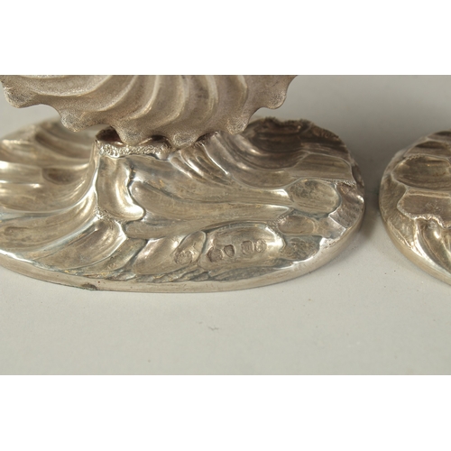 1865 - A GOOD PAIR OF VICTORIAN CAST SILVER SHELL SALTS. London 185, weight: 10ozs.