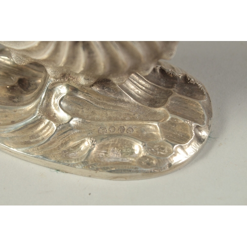 1865 - A GOOD PAIR OF VICTORIAN CAST SILVER SHELL SALTS. London 185, weight: 10ozs.