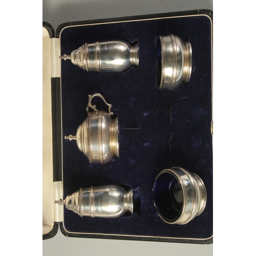 1867 - A FIVE PIECE SILVER CONDIMENT SET, cased. Chester 1910.