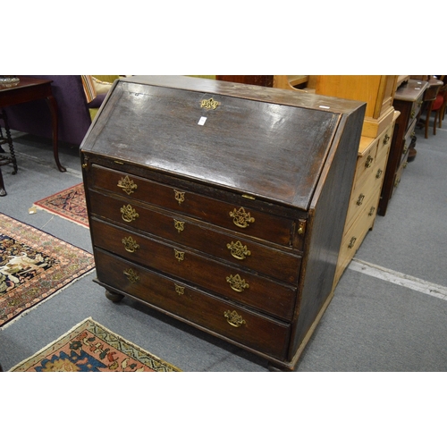 216 - A George III oak bureau.