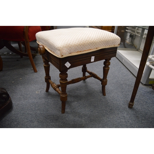 220 - A Victorian walnut adjustable music seat.